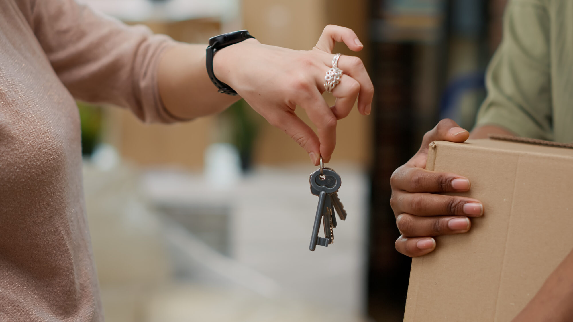 Married couple buying first home and having house keys